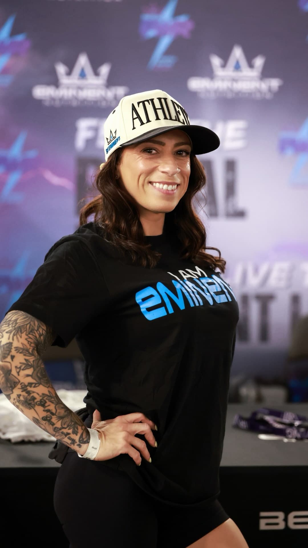 Giselle Marie at an Eminent event in an Athlete hat and I AM EMINENT tee