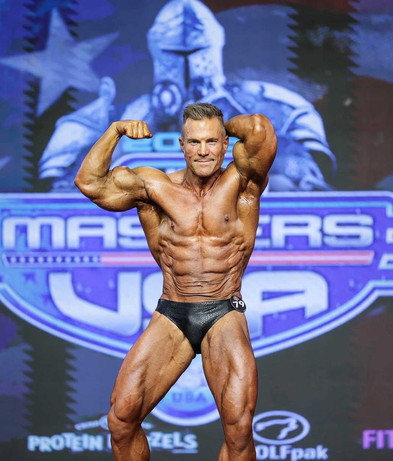 Greg Iannuccilli, front double biceps at NPC Masters USA 2025, competitor 79